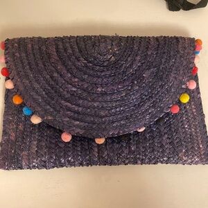 Shiraleah Blue straw envelop clutch with rainbow pompoms